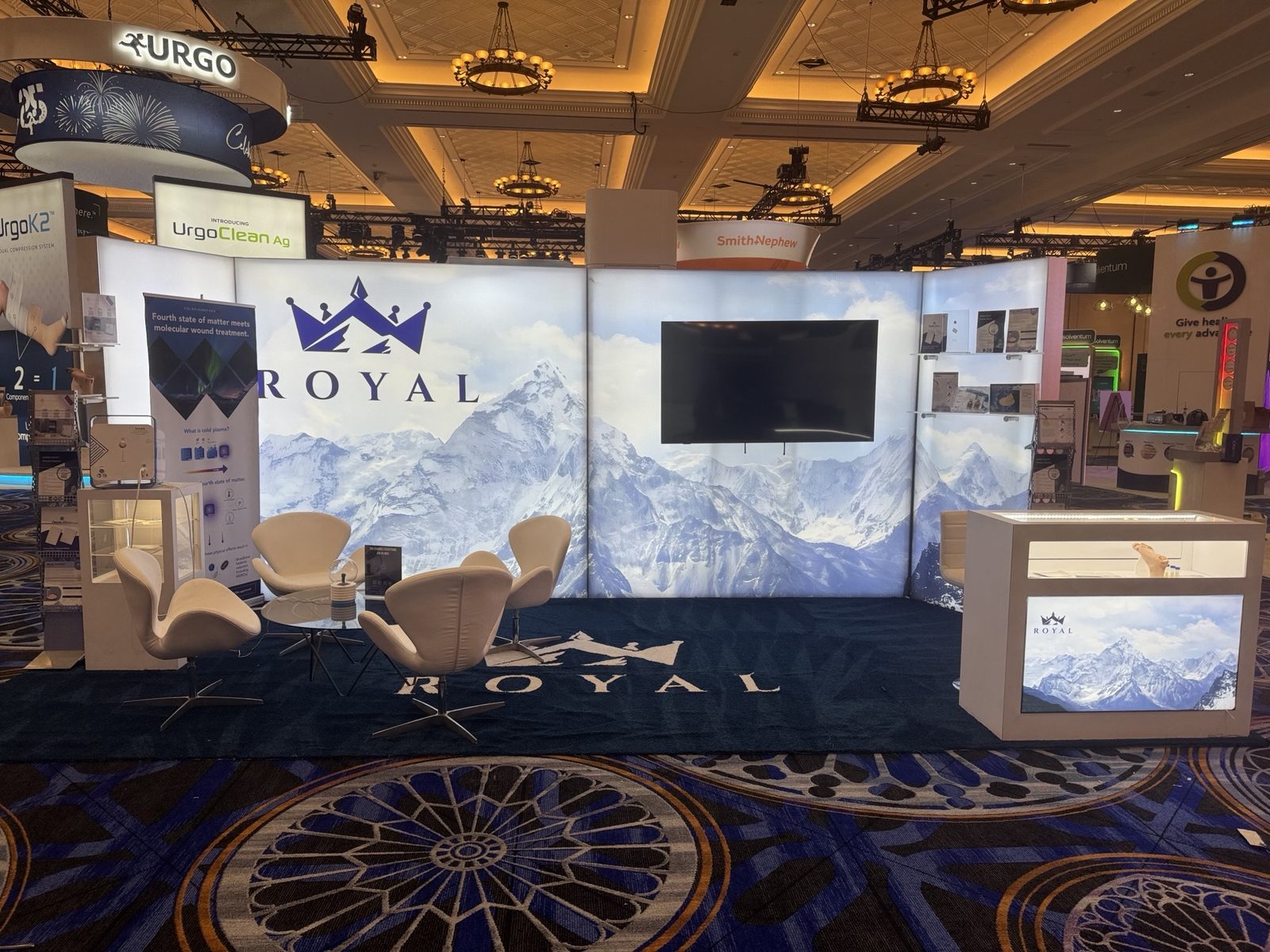 Inline exhibit with a panoramic landscape graphic and a wall-mounted screen